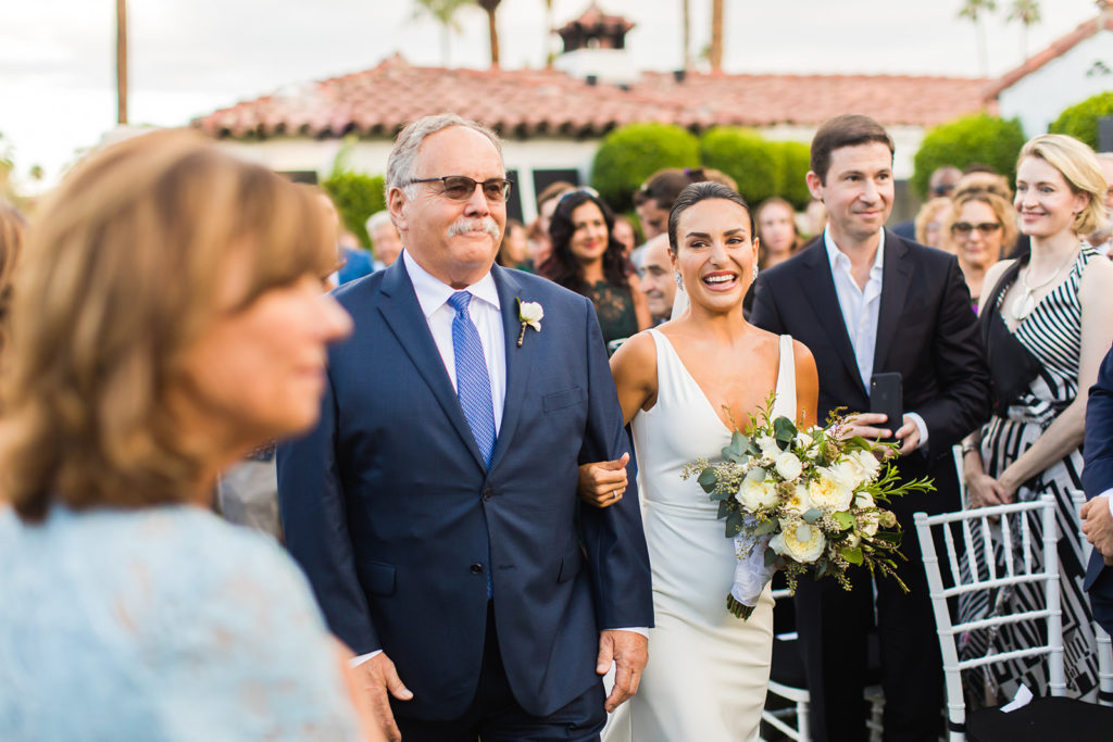 bride escorted in for wedding ceremony