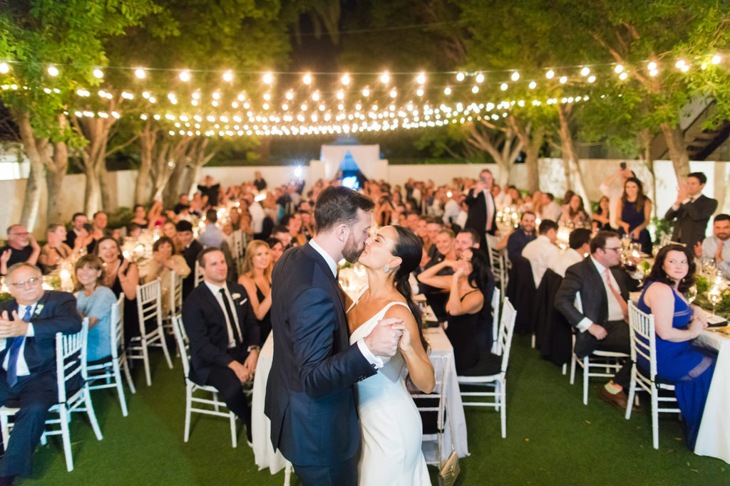 couple kiss at outdoor Avalon Palm Springs wedding